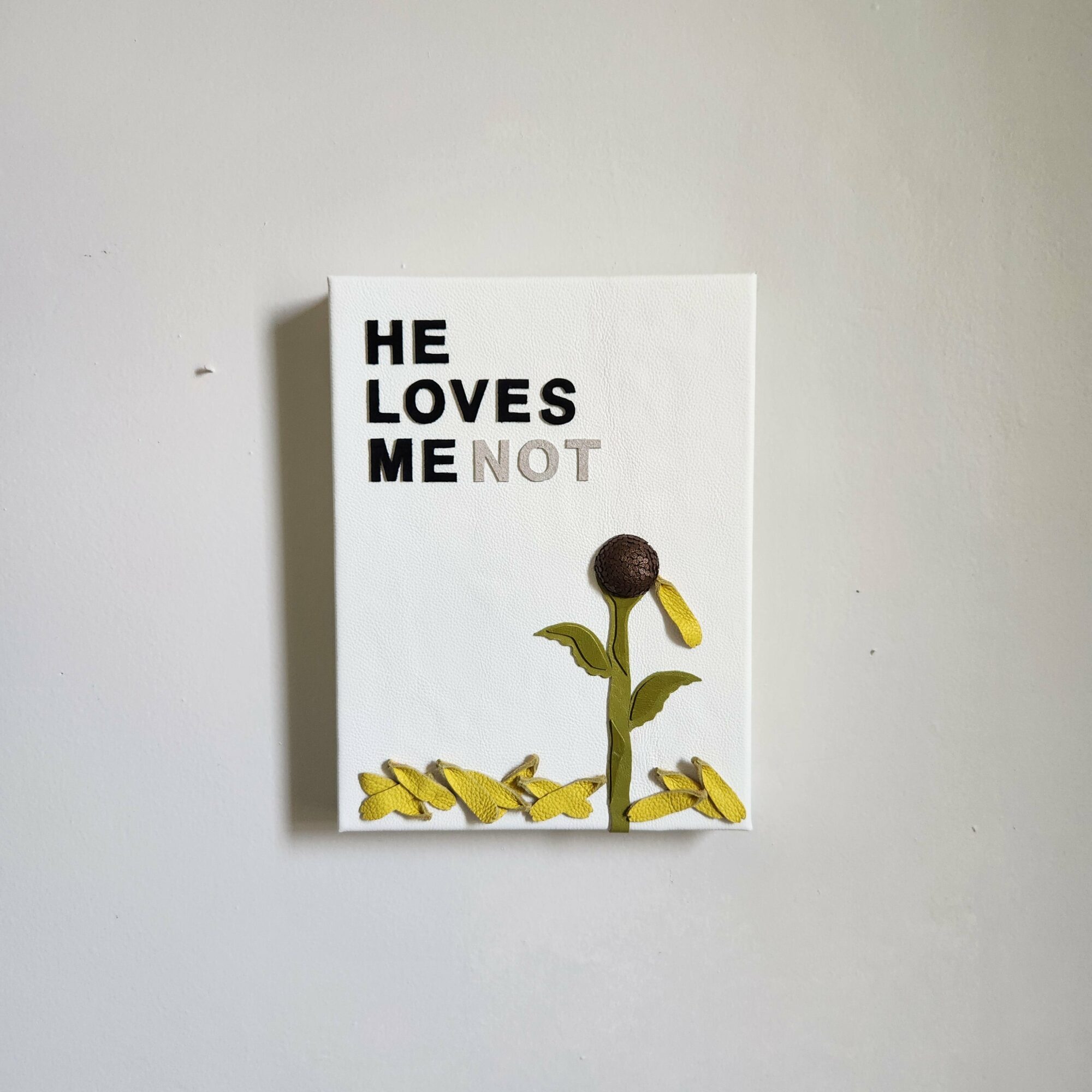 Canvas with text and a sunflower illustration, reading