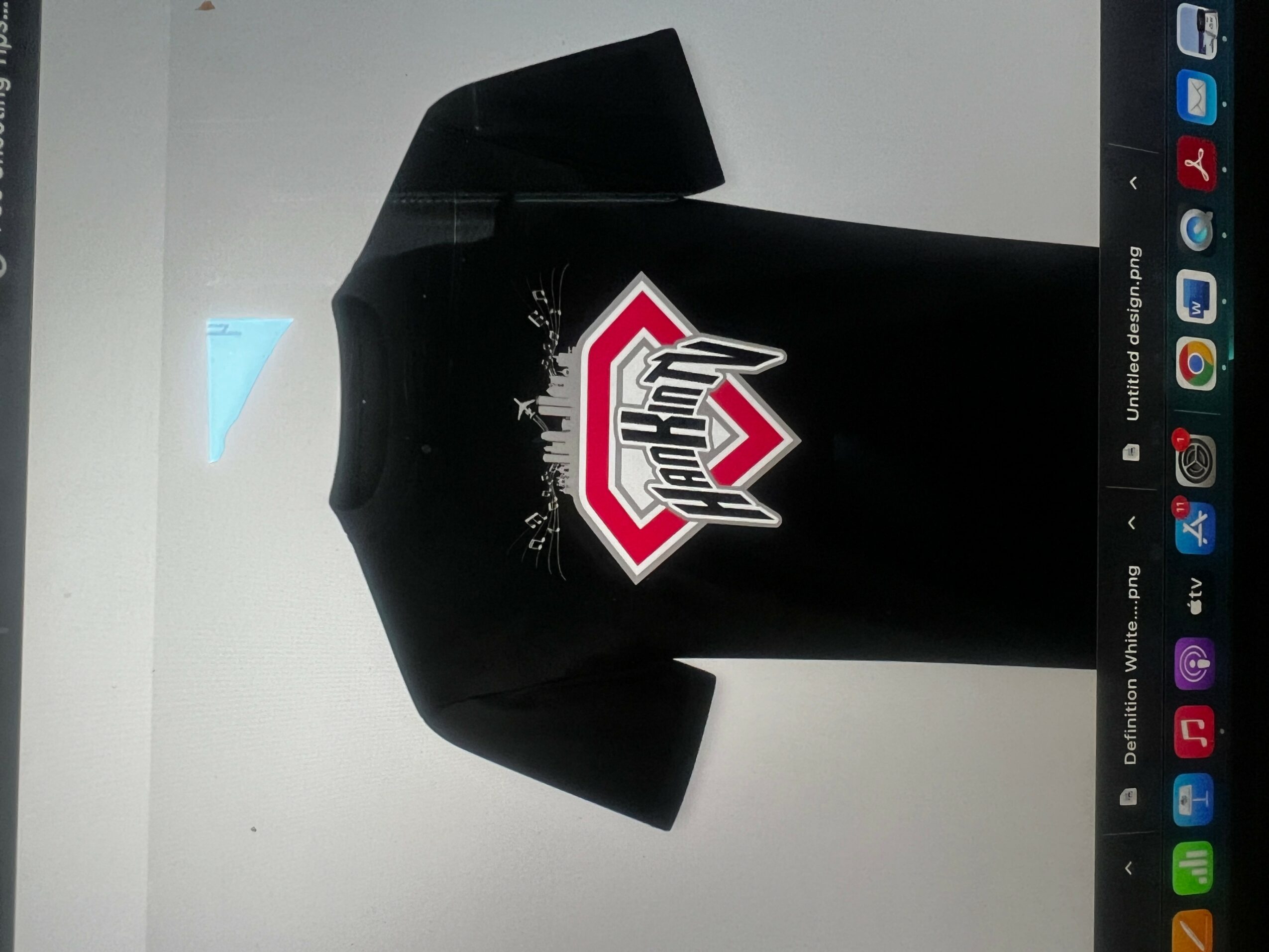 Black sports jersey with a colorful logo on the front, displayed against a white background.