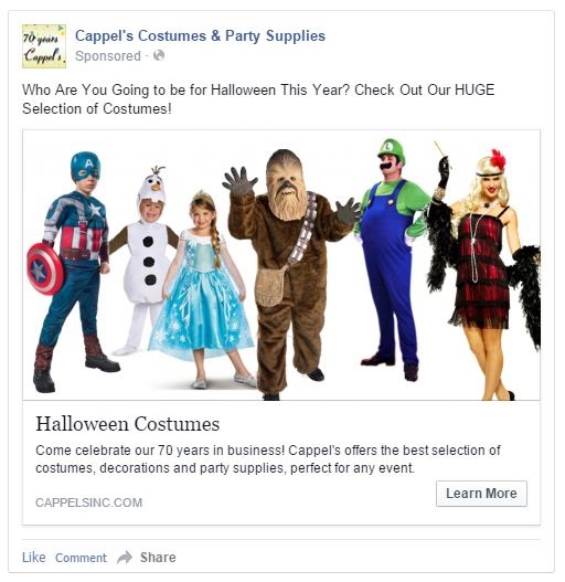 Group of people in various Halloween costumes, including a superhero, snowman, princess, bear, Luigi, and witch, standing together.