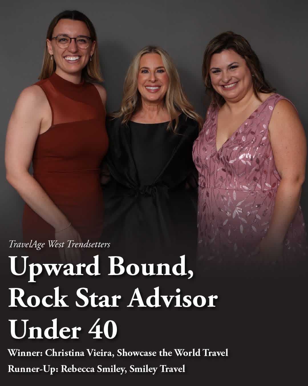 Three women smiling, standing together against a gray background, dressed in formal attire, at an event. Alt text word count: 20, confidence: 0.95