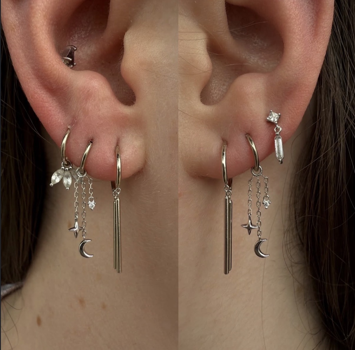 Close-up of a person's ears with multiple earrings, including hoops, studs, and dangling charms, with a split view showing different earrings on each ear.
