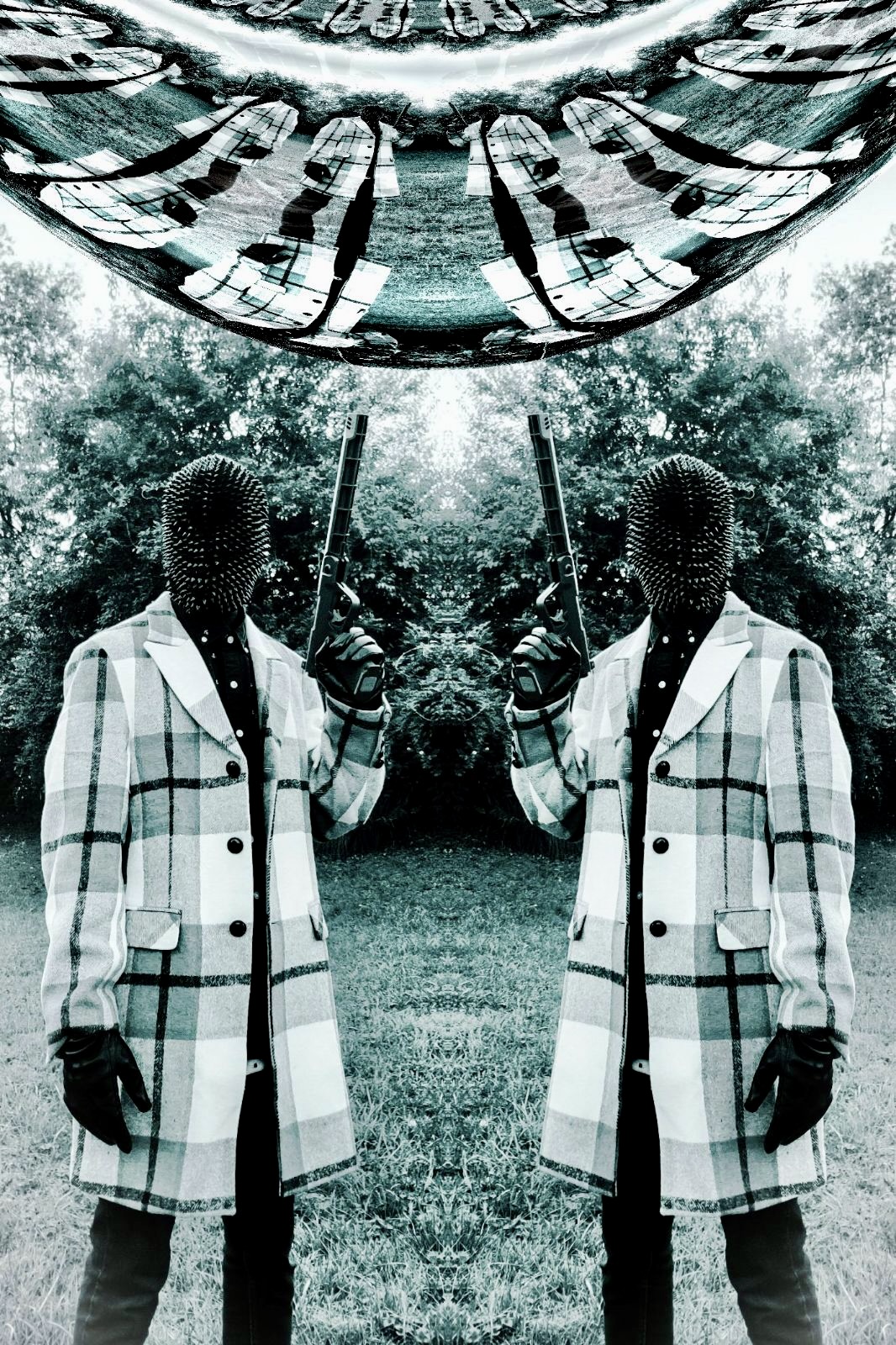 Two people in checkered coats holding sticks outdoors, with a large reflective object above them and trees in the background.