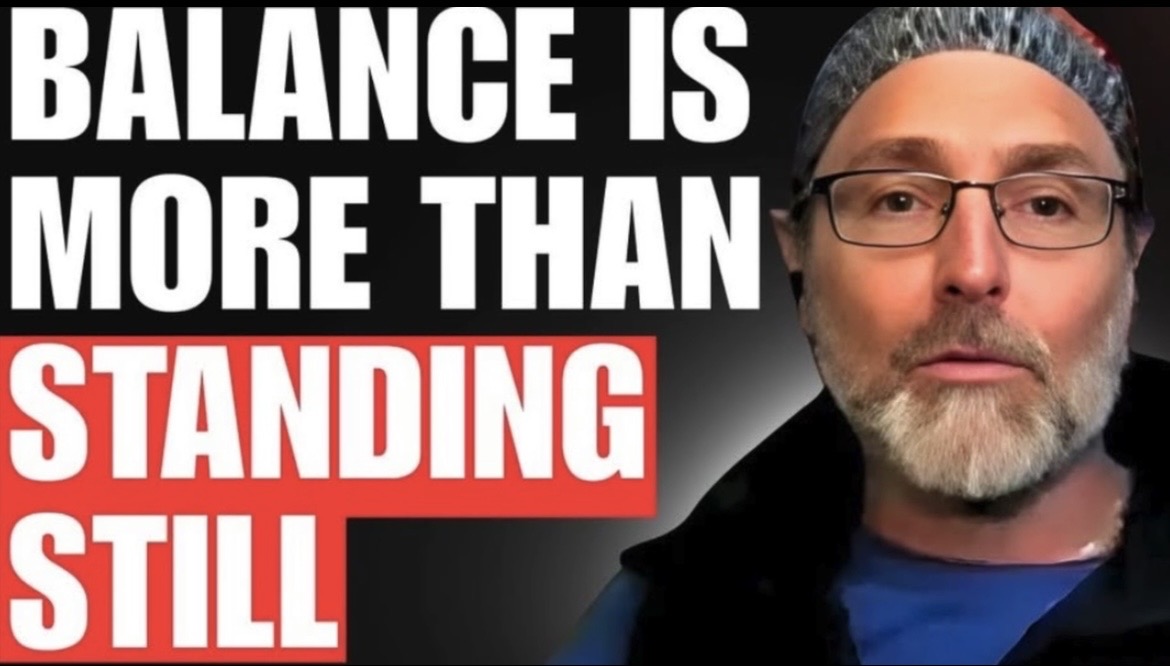 A man with glasses and a beard wearing a cap, with text saying 'Balance is more than standing still'.