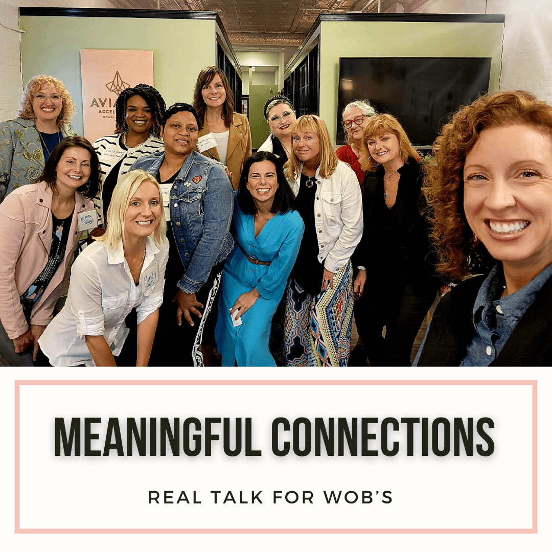 Group of diverse women smiling in an indoor setting, with a sign reading 'Meaningful Connections' below.